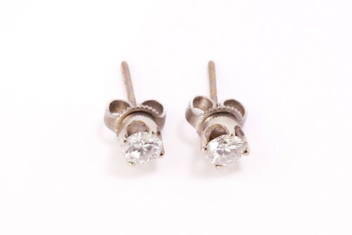 Lot 226 - A pair of diamond stud earrings, each...