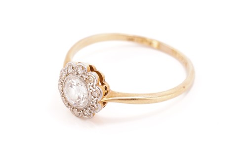 Lot 237 - A diamond daisy head cluster ring, comprising...