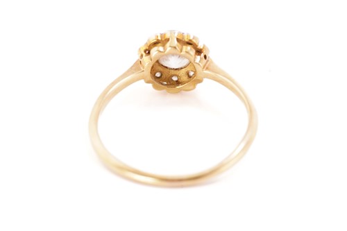 Lot 237 - A diamond daisy head cluster ring, comprising...