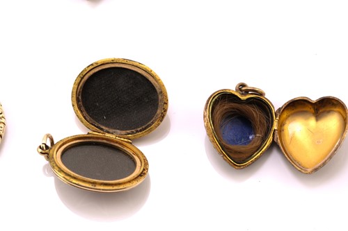 Lot 310 - A 15ct gold mourning ring, three locket...