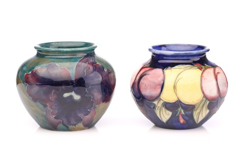 Lot 73 - Two Moorcroft small bulbous vases, 'Wisteria'...