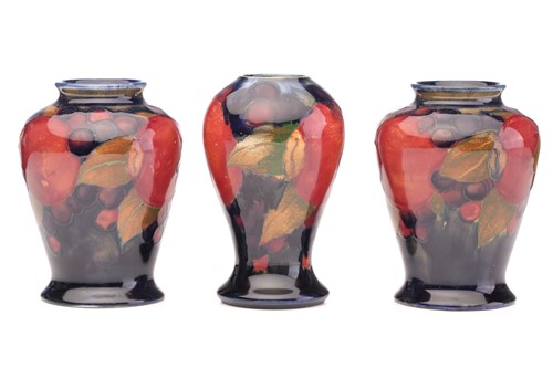 Lot 121 - A pair of Moorcroft 'Pomegranate' small vases,...