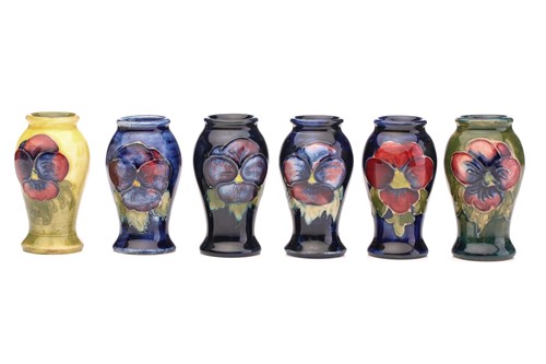 Lot 129 - Six Moorcroft miniature baluster vases, 'Pansy'...