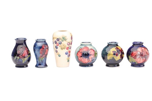 Lot 102 - A collection of six Moorcroft miniature vases,...