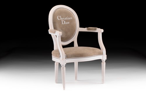 Lot 23 - Christian Dior - A display chair; cream...
