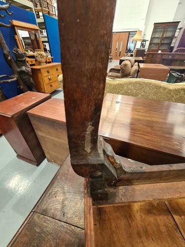 Lot 267 - An early 18th-century oak kneehole lowboy with...