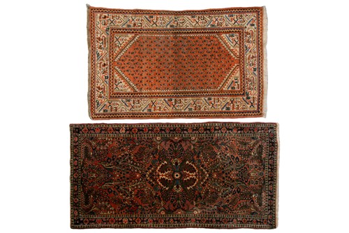 Lot 320 - A small Sarouk rug with a distinctive pink...