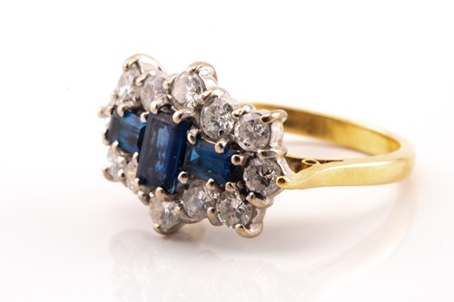 Lot 100 - A sapphire and diamond cluster ring in 18ct...