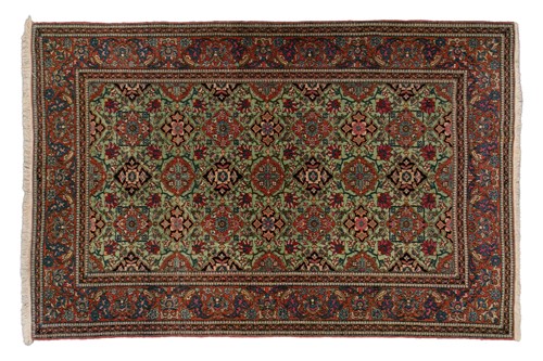 Lot 329 - An old Kirman/ Kerman rug with allover floral...
