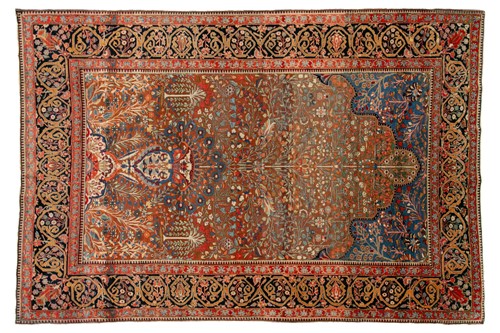 Lot 335 - An old Motashemi Kashan rug with a flowering...