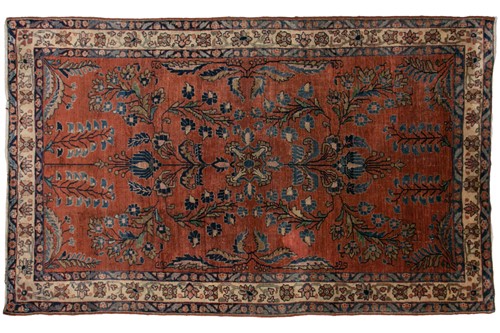 Lot 321 - An old silk Kashan rug with stylized shrubs...