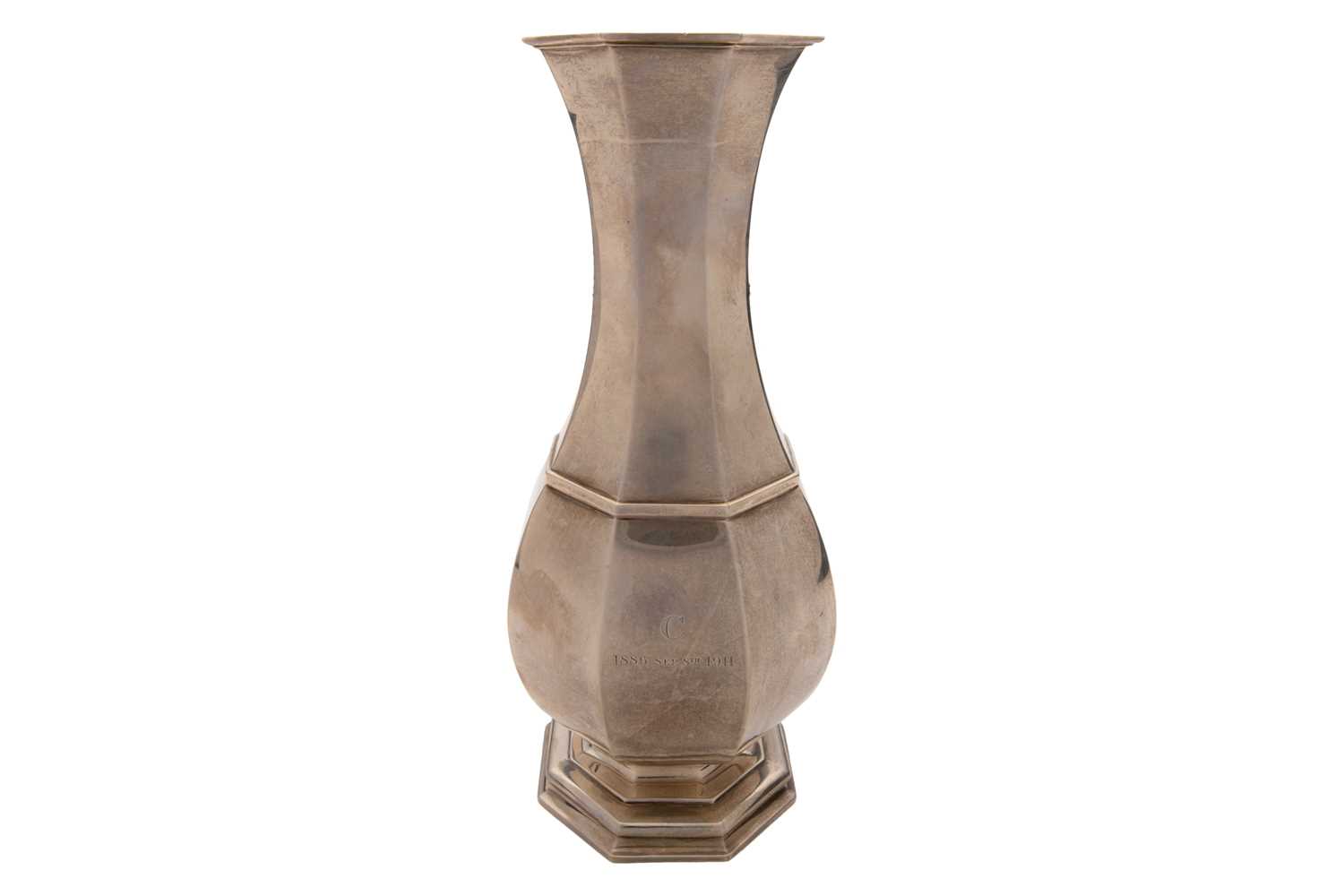 Lot 384 - A silver vase; of panelled baluster form on...