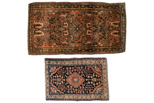 Lot 323 - An old Sarouk rug with sprays of flowers on a...