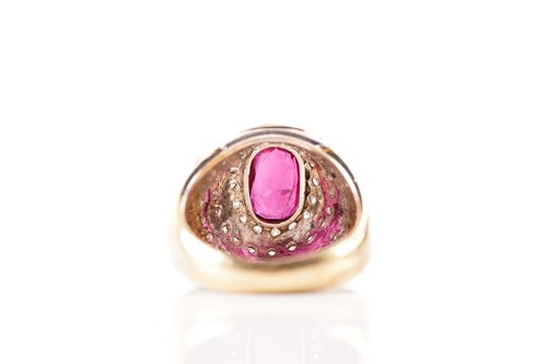 Lot 54 - A ruby and diamond dress ring, containing an...
