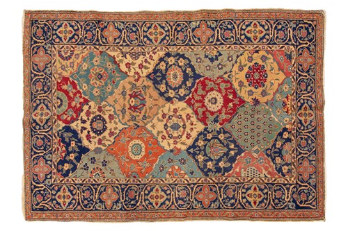 Lot 337 - An old probably Kerman rug with an all-over...