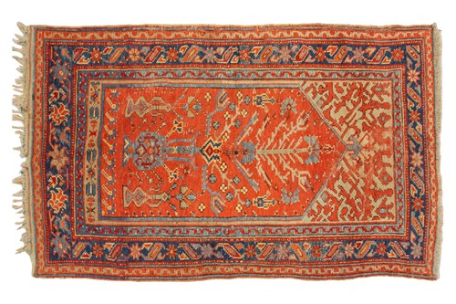 Lot 331 - An old Turkish Ushak rug with a stylized tree...