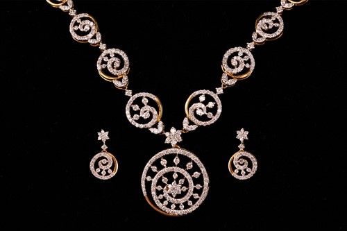 Lot 12 - A diamond-set necklace and earrings suite, of...
