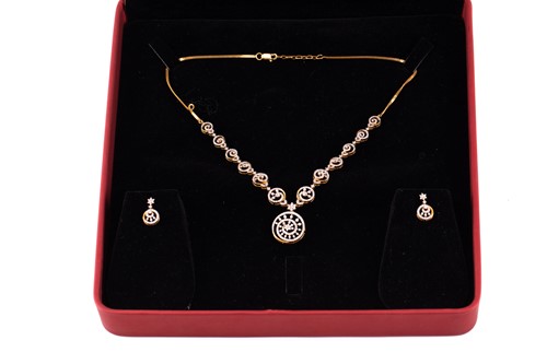 Lot 12 - A diamond-set necklace and earrings suite, of...