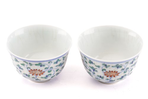 Lot 153 - A pair of Chinese Wucai tea bowls, painted...