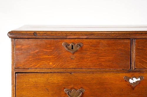 Lot 249 - An 18th century oak chest on later stand, the...