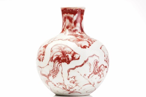 Lot 159 - A Chinese celadon porcelain vase,with relief...