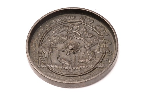 Lot 137 - A Chinese bronze mirror, Qing, 19th century,...