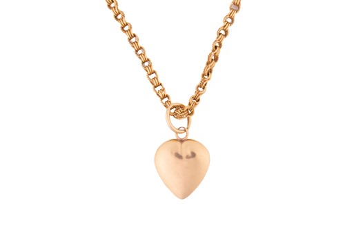 Lot 309 - A heart pendant on chain, comprising a hollow...