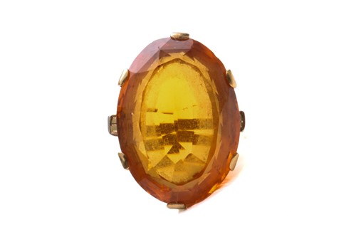 Lot 35 - A large citrine dress ring in 18ct yellow gold,...