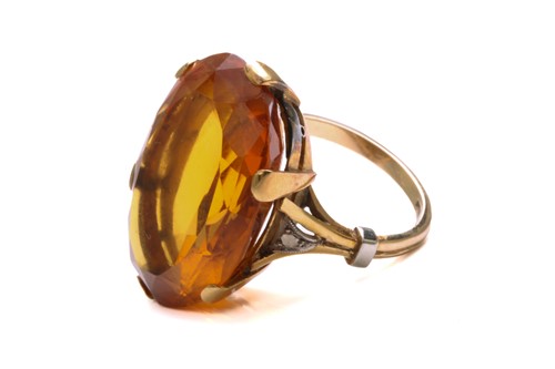 Lot 35 - A large citrine dress ring in 18ct yellow gold,...