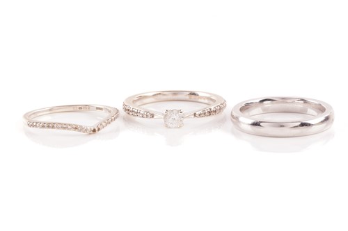Lot 111 - Two diamond-set rings and a silver ring;...