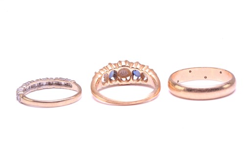 Lot 122 - Three gem-set rings; including a diamond...