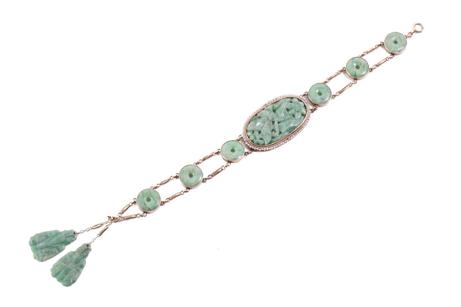 Lot 20 - A carved jade and pearl bracelet, featuring an...