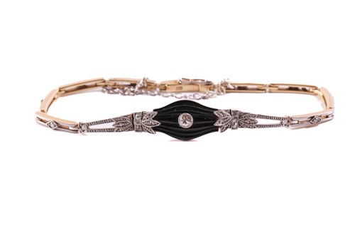 Lot 81 - An onyx and diamond bracelet, comprising a...