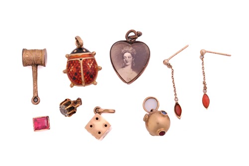 Lot 297 - A quantity of charms and a pair of coral...