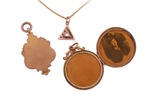 Lot 269 - A gem-set pendant on chain, a pendant and a...