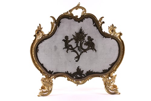Lot 273 - A Louis XV style gilt metal firescreen, of...