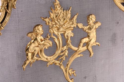 Lot 273 - A Louis XV style gilt metal firescreen, of...