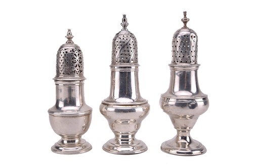 Lot 455 - Three George III silver sugar casters each...