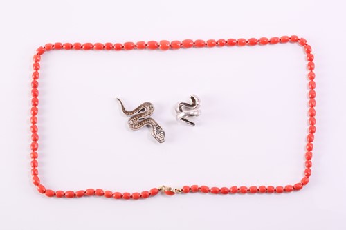 Lot 109 - A precious coral necklace, a serpent ring and...