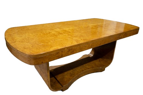 Lot 275 - An Art Deco burr maple dining table and six...
