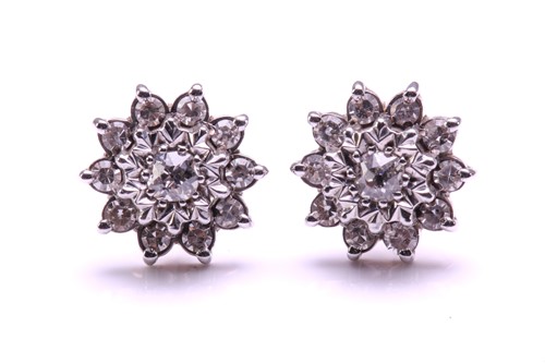 Lot 203 - A pair of diamond cluster stud earrings, each...