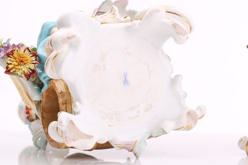 Lot 430 - A pair of Meissen three branch candelabra,...