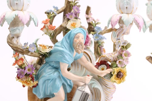 Lot 430 - A pair of Meissen three branch candelabra,...