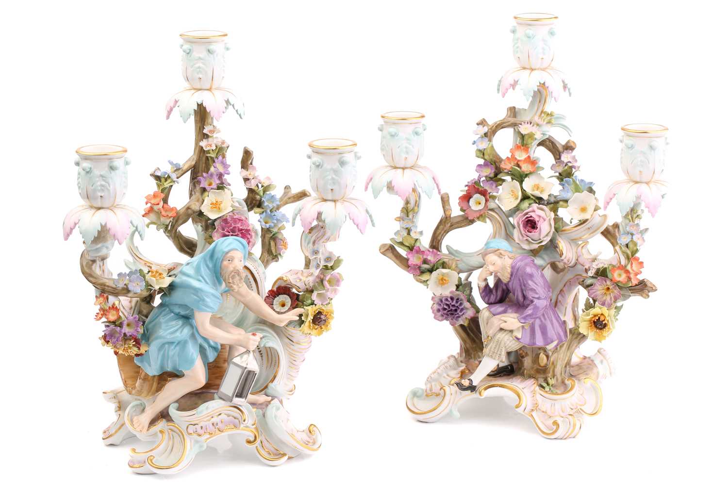 Lot 430 - A pair of Meissen three branch candelabra,...