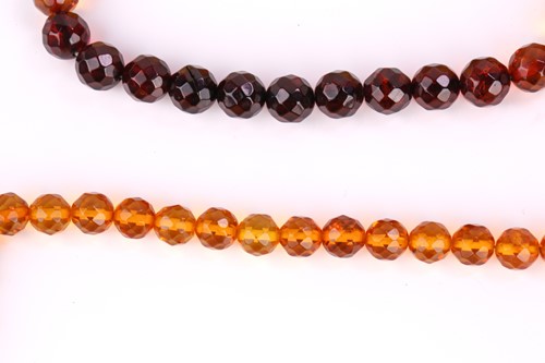 Lot 115 - A set of two amber bead bracelets and two...