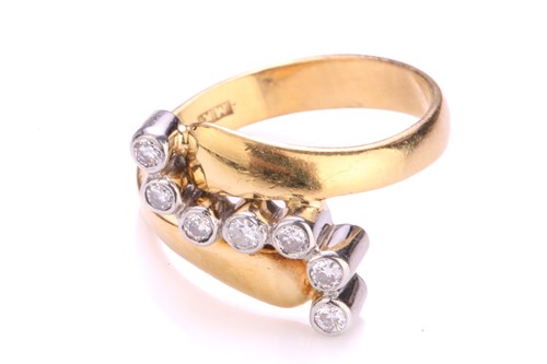 Lot 242 - A diamond bypass ring in 18ct gold, containing...