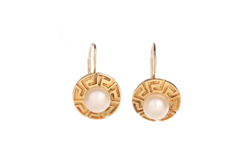 Lot 274 - A pair of pearl set disk earrings, formed from...