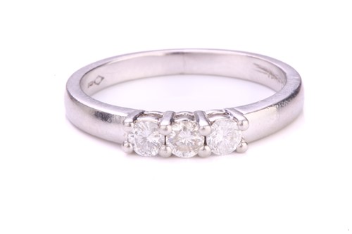 Lot 177 - A three-stone diamond ring in platinum, with...
