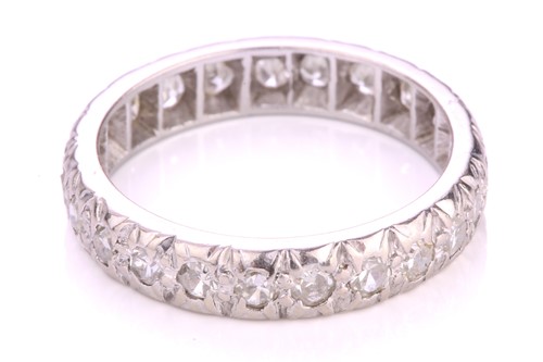Lot 156 - A diamond eternity ring in platinum,...