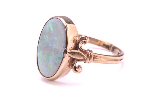 Lot 219 - A precious opal dress ring in 9ct gold,...